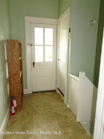 a view of balcony with wooden floor and fence