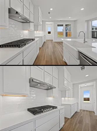 a kitchen with kitchen island a stove a sink and a refrigerator