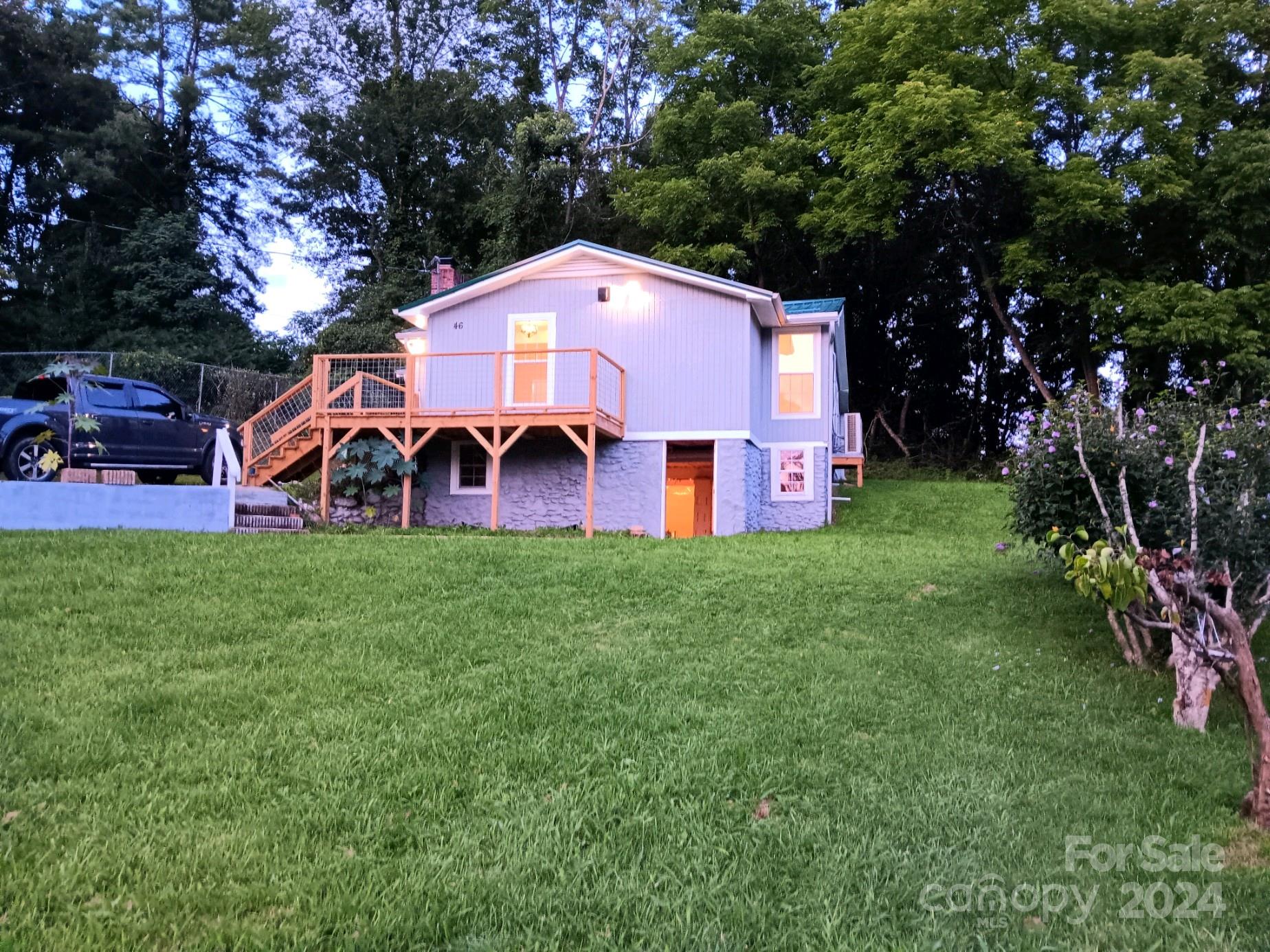 46 Lewis Street Canton, NC 28716 - Photo 2 of 27 a front view of house with yard and outdoor seating