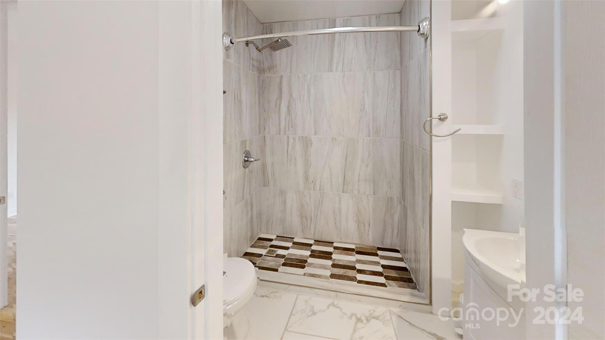 46 Lewis Street Canton, NC 28716 - Photo 21 of 27 a bathroom with a shower and a sink