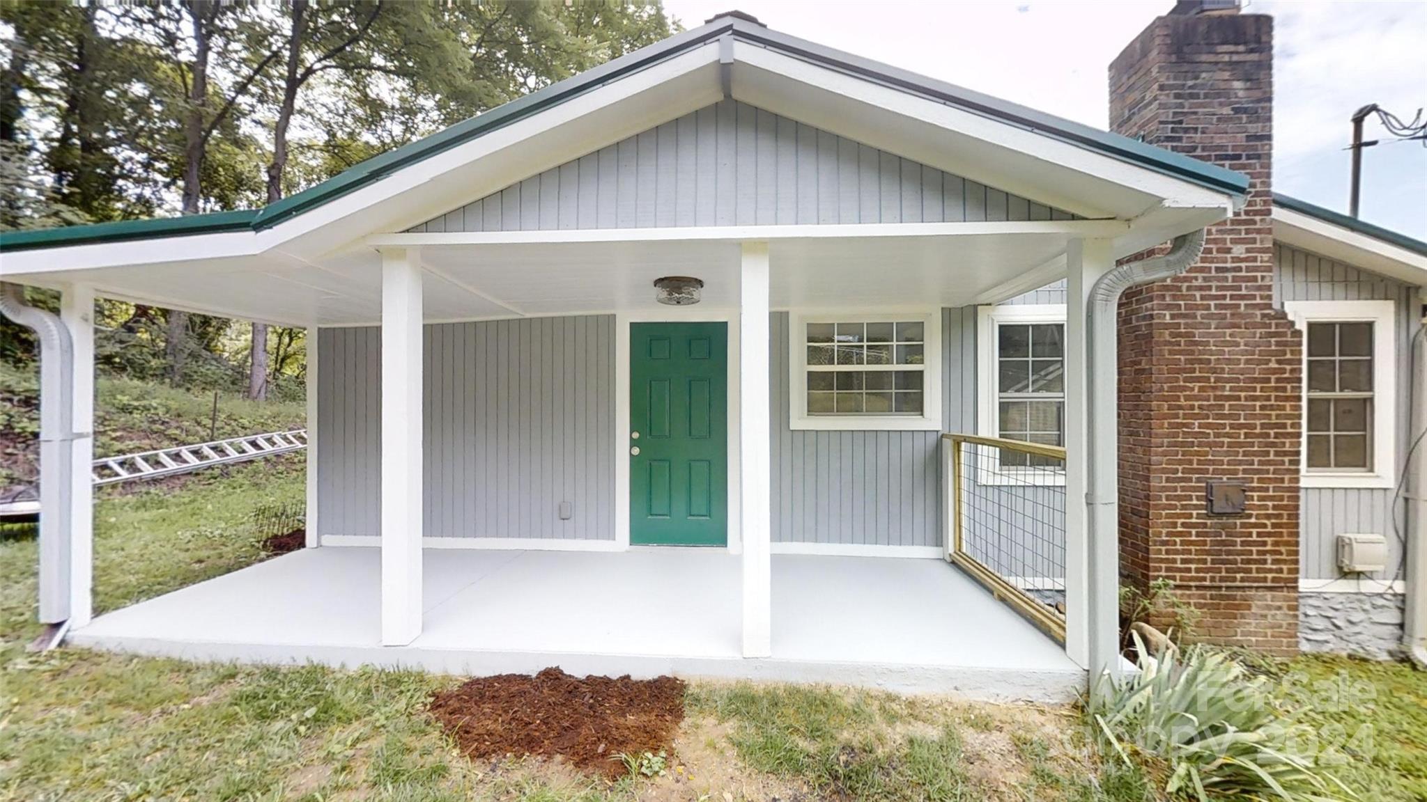 46 Lewis Street Canton, NC 28716 - Photo 6 of 27 a view of a house with porch