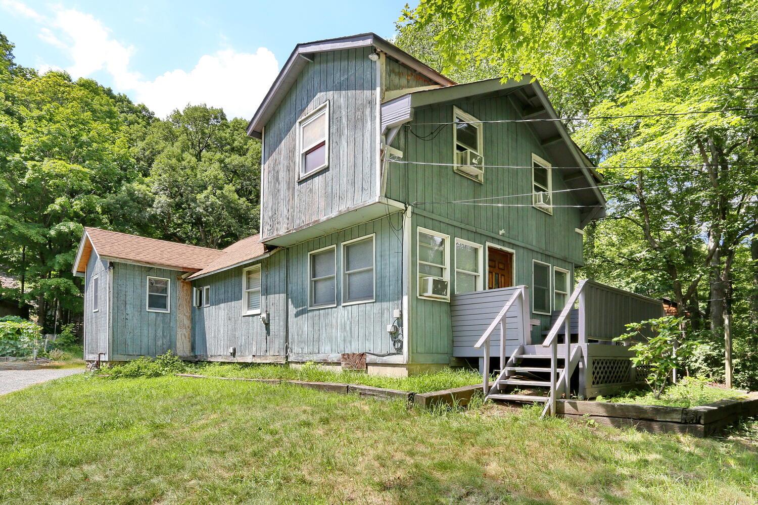 325 Call Hollow Road Haverstraw, NY 10980 - Photo 4 of 12 View of front of house featuring a wooden deck and a front lawn