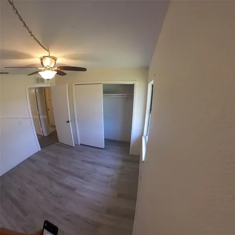 a view of a livingroom with wooden floor