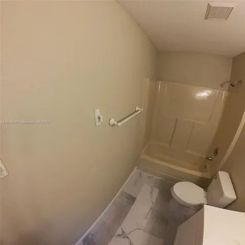 a bathroom with a sink and toilet
