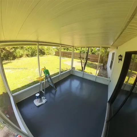 a view of swimming pool with furniture