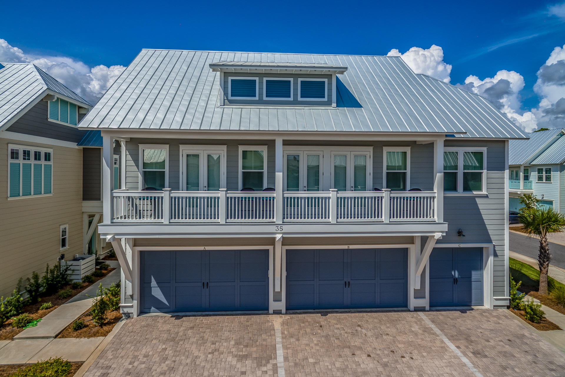 120 East Pine Lands Loop, Unit B Inlet Beach, FL 32461 - Photo 1 of 36 a front view of a house with a garden