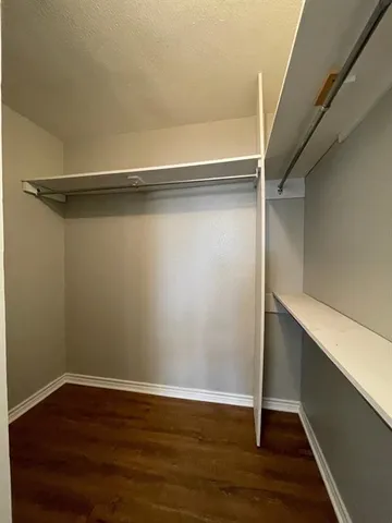 a view of an empty walk in closet