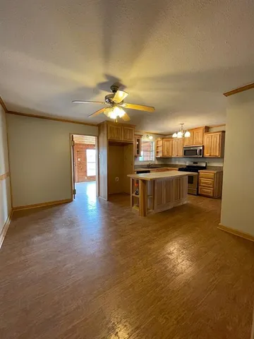 a kitchen with stainless steel appliances granite countertop a stove and a sink