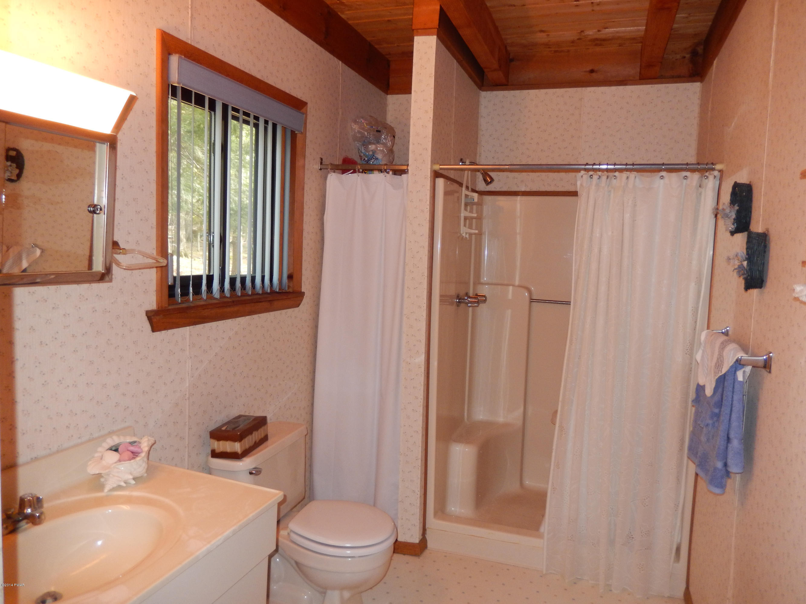 3190 Northgate Road Lake Ariel, PA 18436 - Photo 20 of 56 a bathroom with a sink toilet and shower