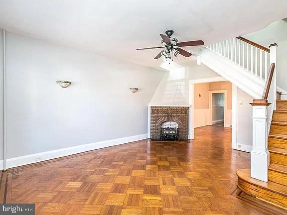 a view of a livingroom with a ceiling fan and window