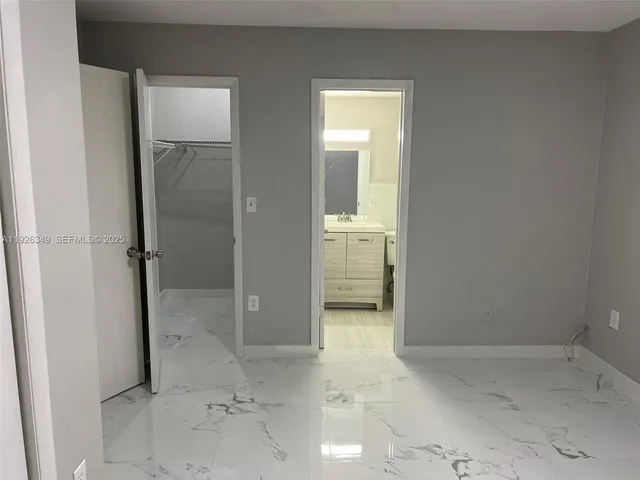 a bathroom with a shower a toilet and sink