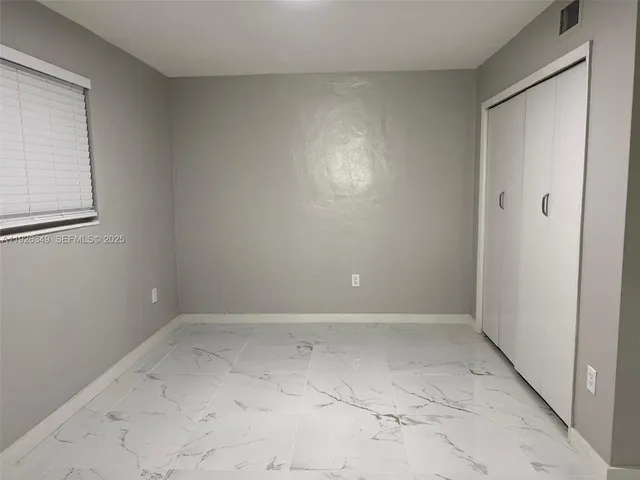 a bathroom with a shower and a toilet