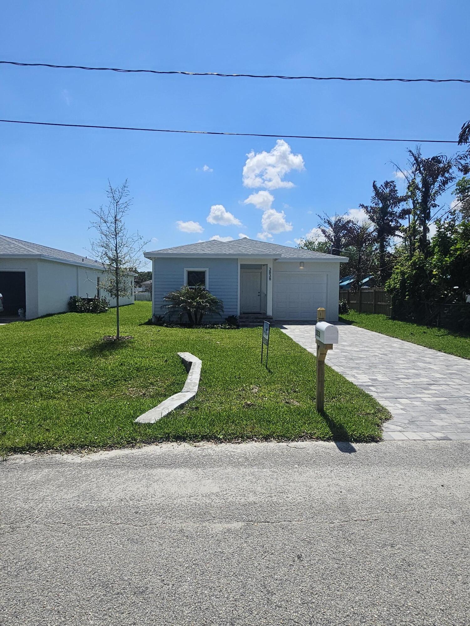 3838 Southeast Grant Street Stuart, FL 34997 - Photo 2 of 39 a view of a back yard of the house