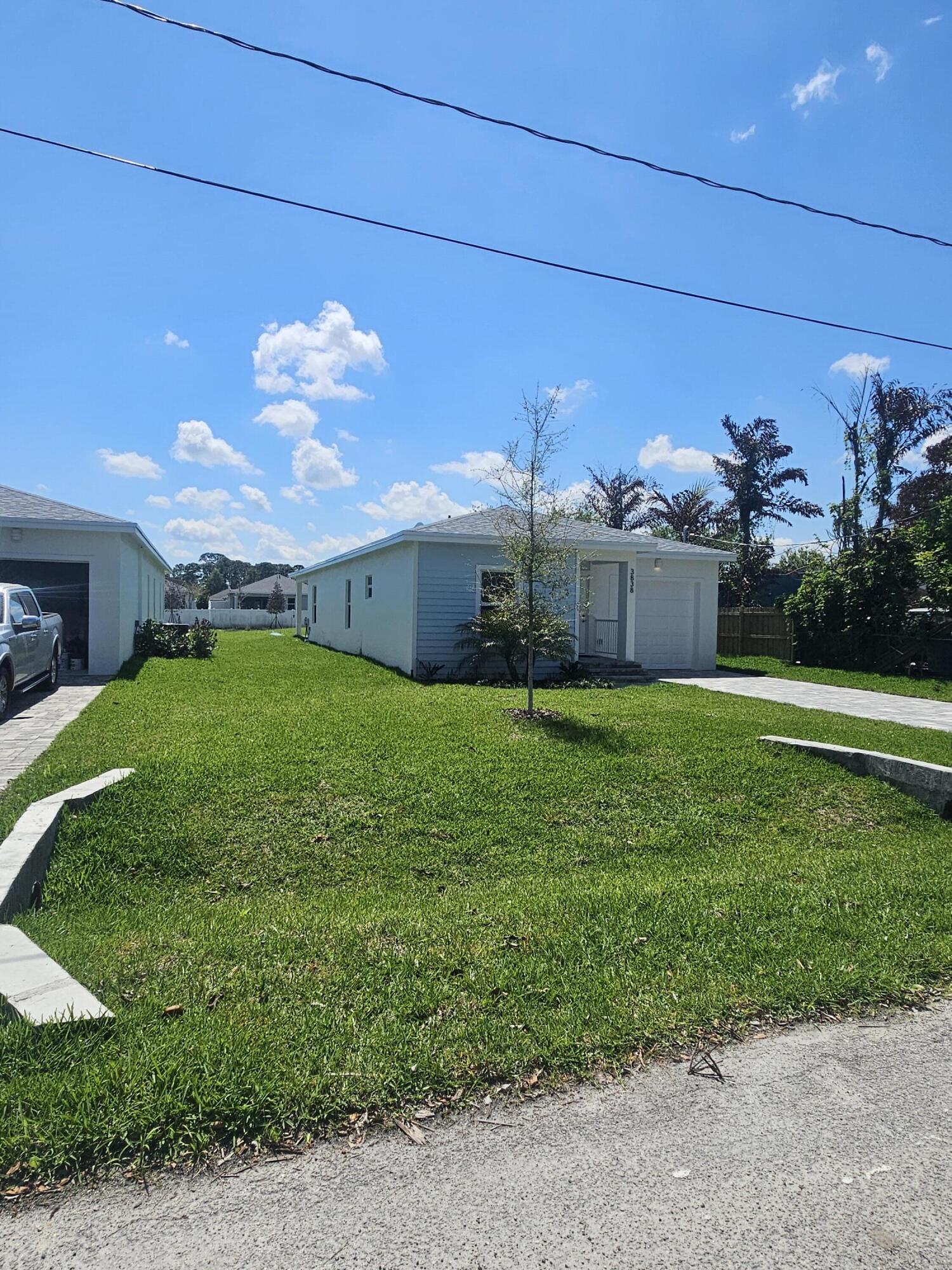3838 Southeast Grant Street Stuart, FL 34997 - Photo 3 of 39 a view of a back yard of the house