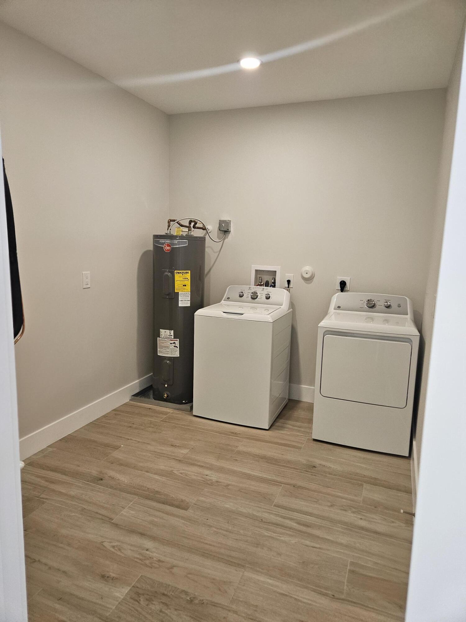 3838 Southeast Grant Street Stuart, FL 34997 - Photo 38 of 39 a utility room with dryer and washer