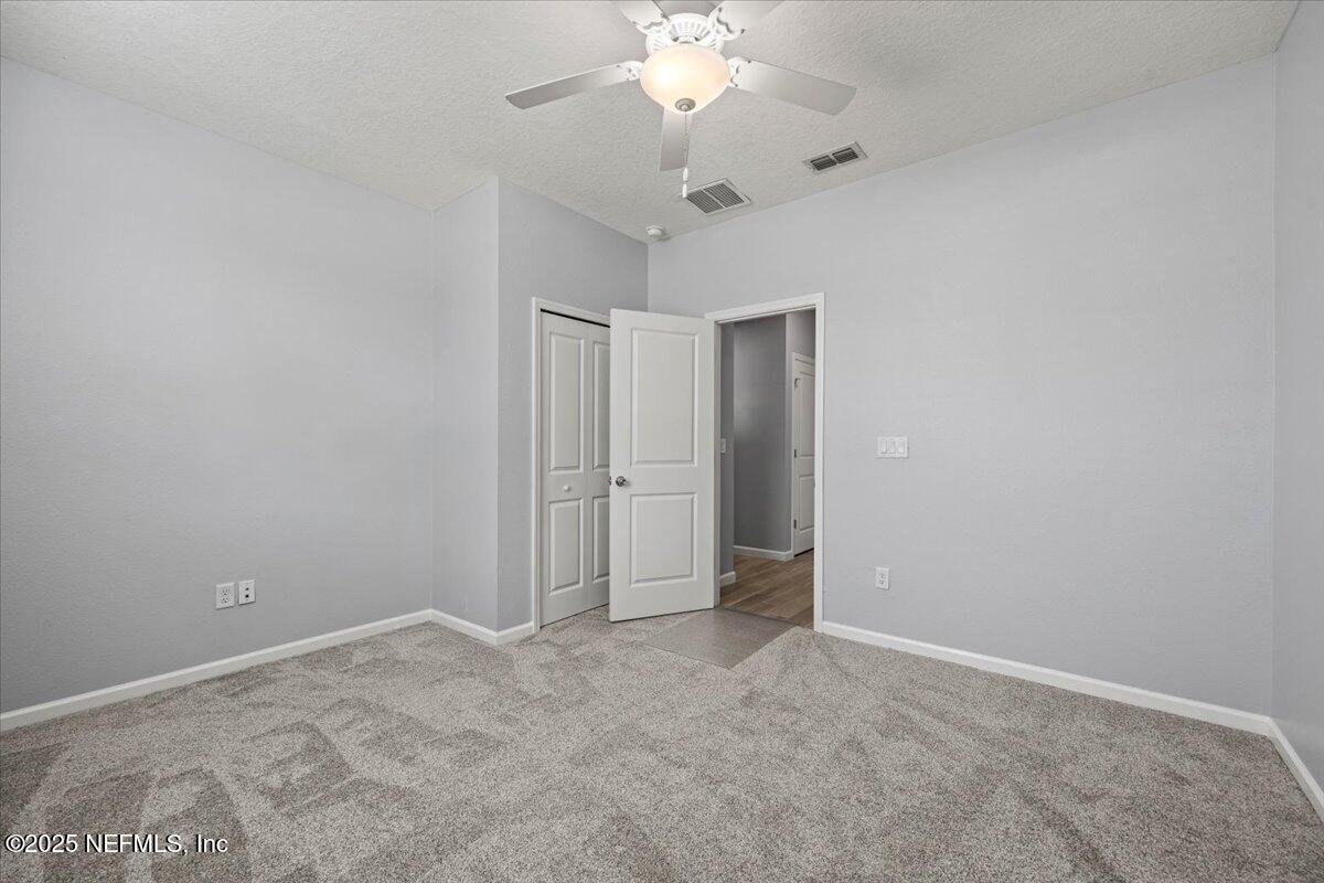 1728 Amberly Drive Middleburg, FL 32068 - Photo 21 of 32 a view of an empty room and chandelier fan