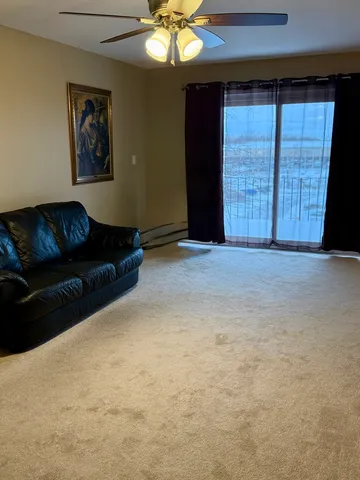 a living room with furniture and window
