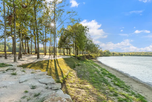 an aerial view of a house with a lake view