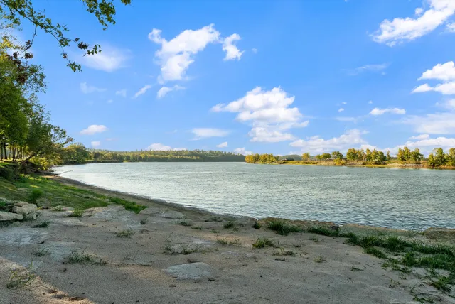 a view of an ocean with a mountain