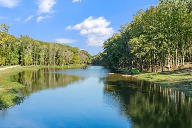 a view of a lake with a big yard