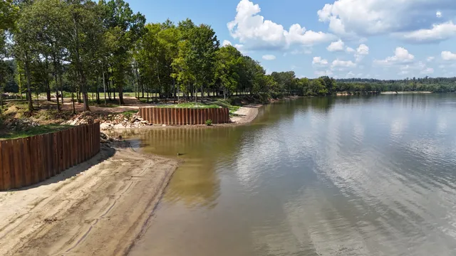 an aerial view of a house with a lake view