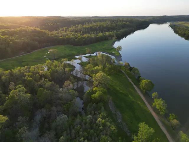 an aerial view of a houses with ocean view