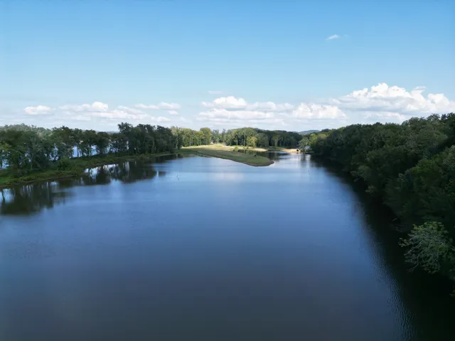 a view of yard with swimming pool and green space