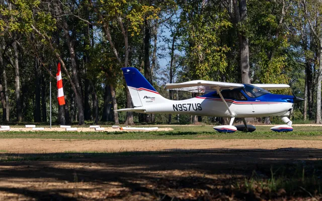 a view of a city with green field
