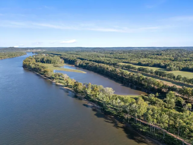 a view of grassy field with mountain