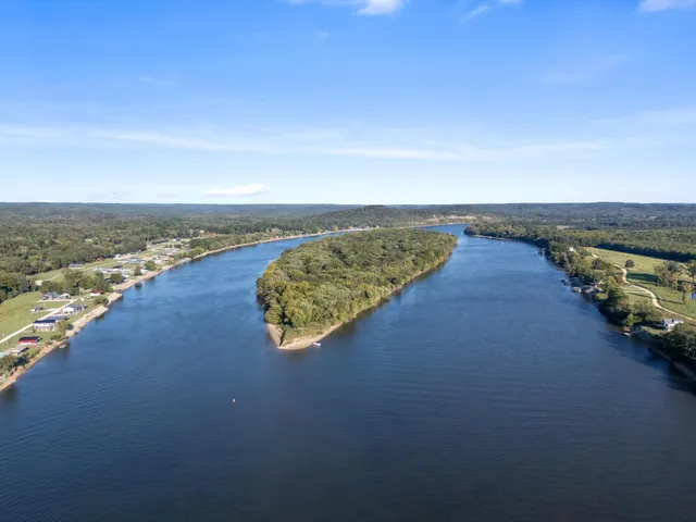 a sunset view with a lake
