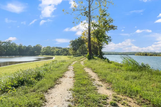 a view of a basketball court in front of a house