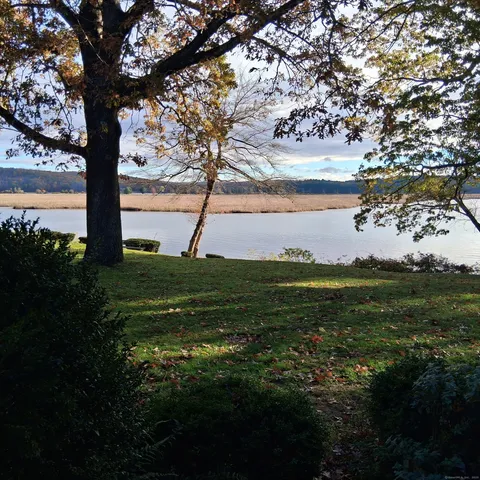 a view of a lake with a big yard