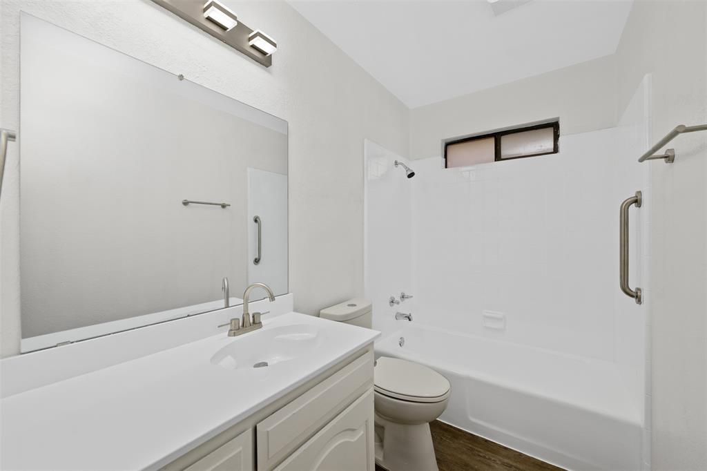 720 Sandy Trail Fort Worth, TX 76120 - Photo 19 of 24 a bathroom with a sink a toilet and shower