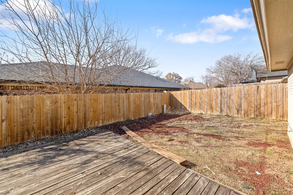 720 Sandy Trail Fort Worth, TX 76120 - Photo 22 of 24 a view of a backyard of the house