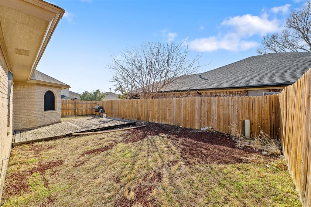 720 Sandy Trail Fort Worth, TX 76120 - Photo 23 of 24 a view of a backyard of the house