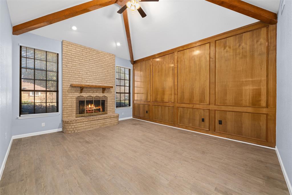 720 Sandy Trail Fort Worth, TX 76120 - Photo 6 of 26 a view of an empty room with a fireplace and a window