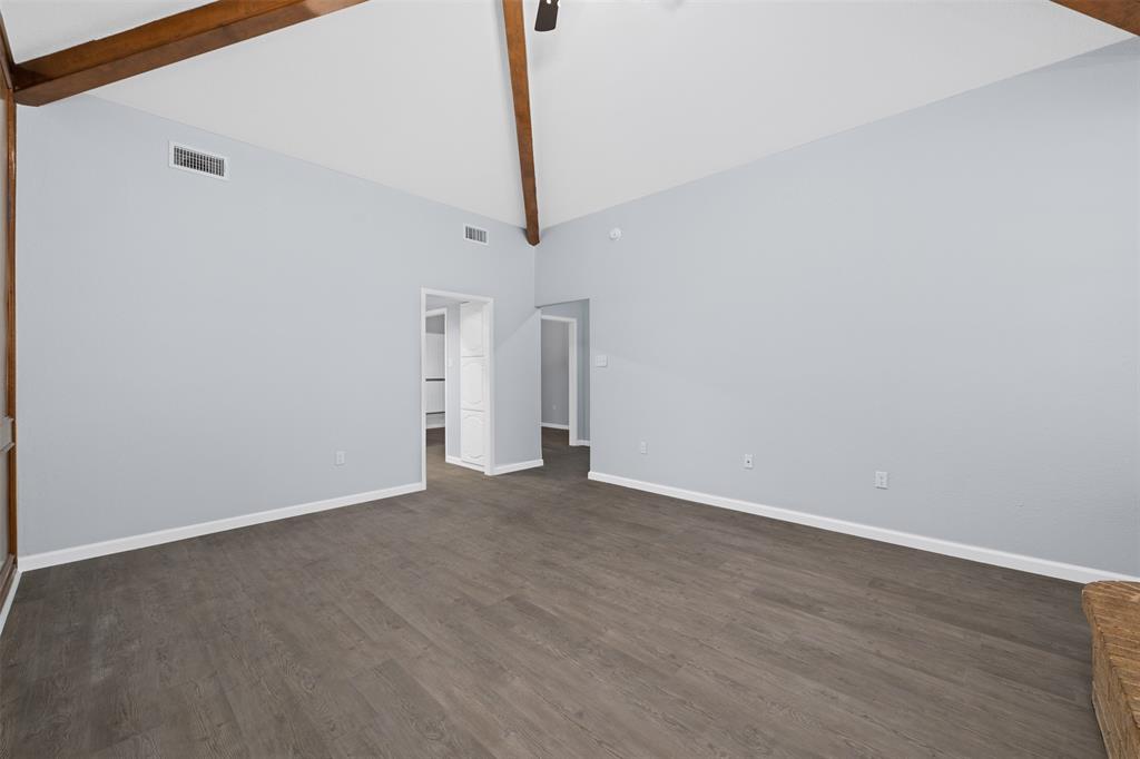 720 Sandy Trail Fort Worth, TX 76120 - Photo 7 of 26 a view of an empty room with wooden floor