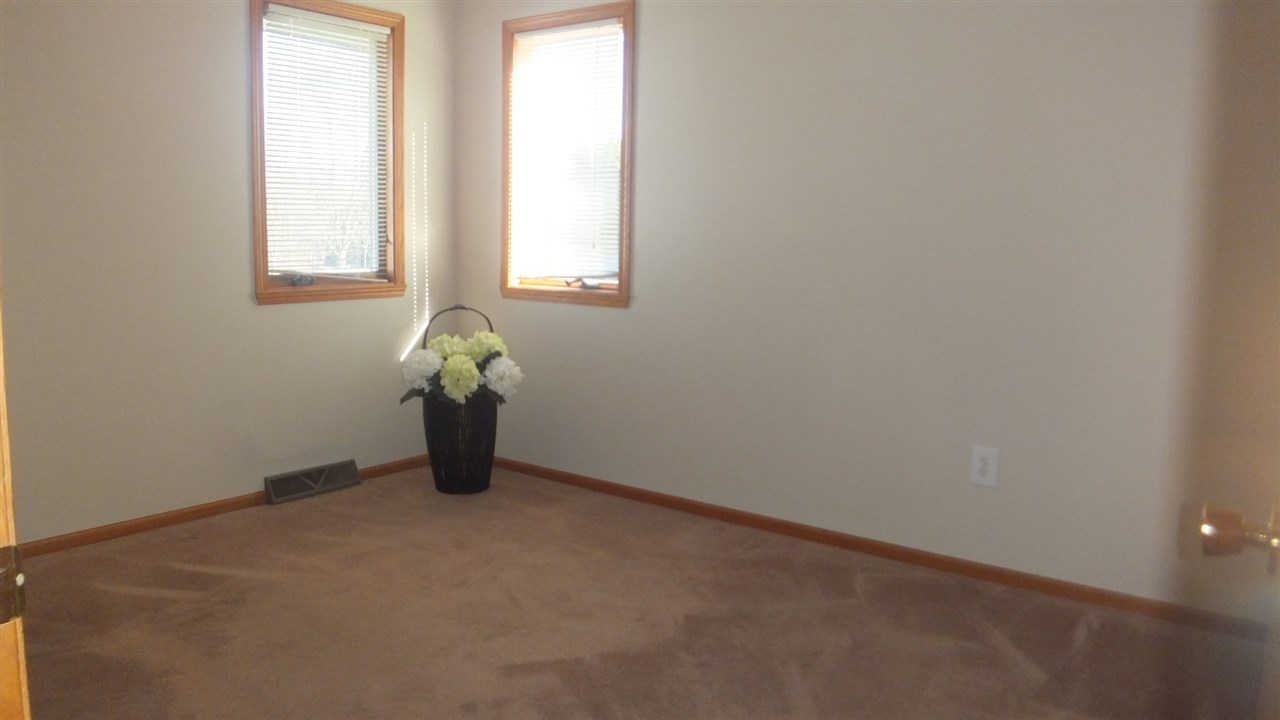 120 Minarette Drive Southwest Poplar Grove, IL 61065 - Photo 12 of 22 an empty room with windows