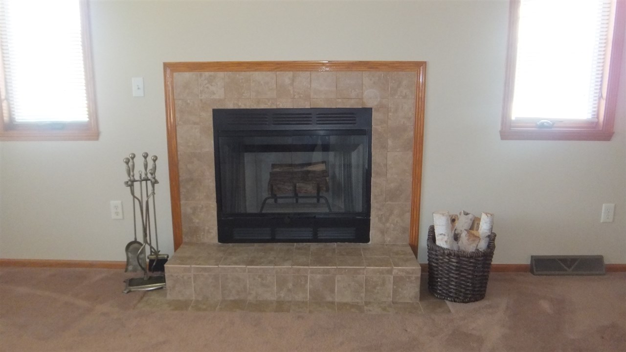 120 Minarette Drive Southwest Poplar Grove, IL 61065 - Photo 7 of 22 a room with a fireplace