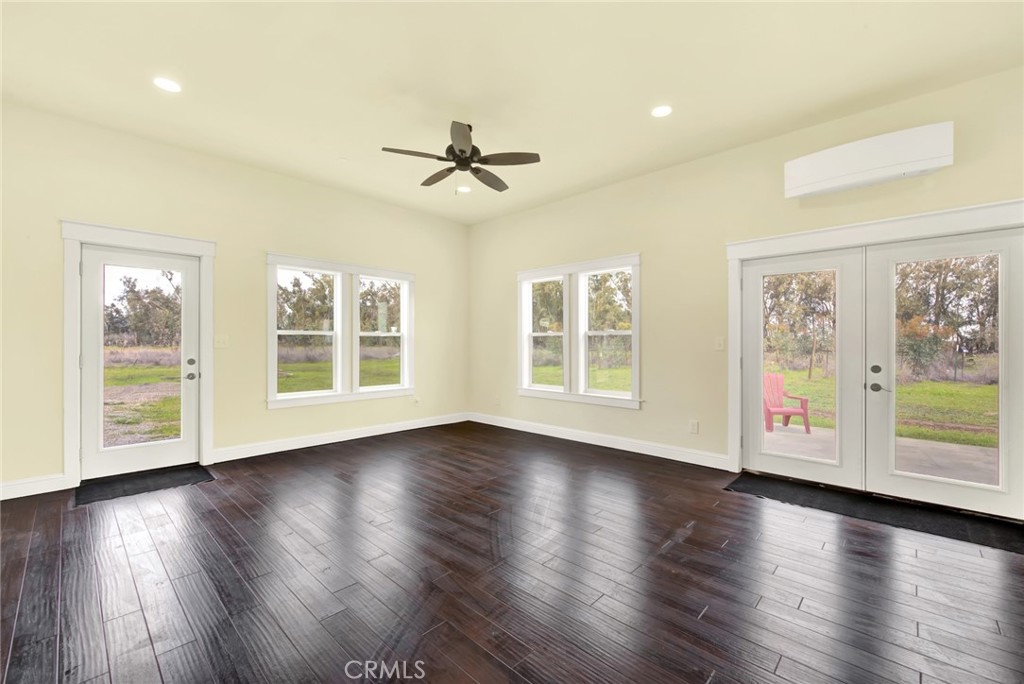 20506 Corning Road Corning, CA 96021 - Photo 15 of 53 a view of an empty room with wooden floor and a window