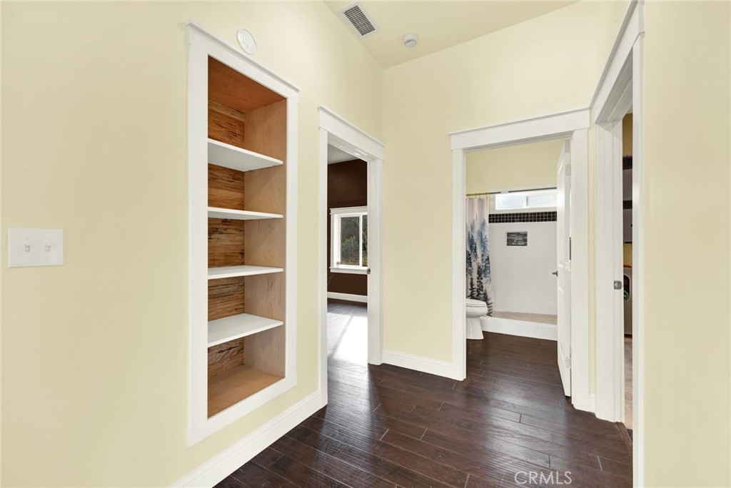 20506 Corning Road Corning, CA 96021 - Photo 21 of 53 a view of walk in closet with wooden floor