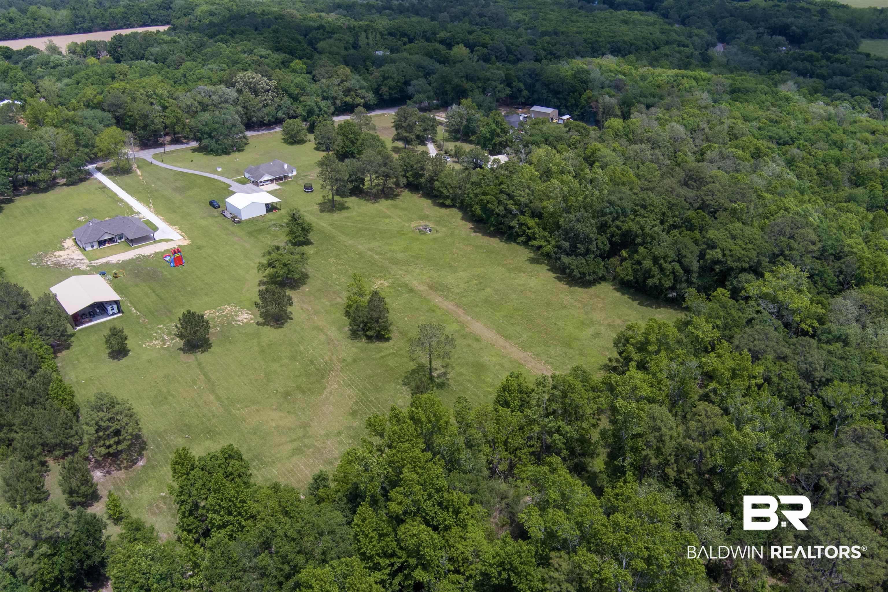 13925 Fort Lake Road Grand Bay, AL 36541 - Photo 31 of 37 Birds eye view of property featuring a wooded view