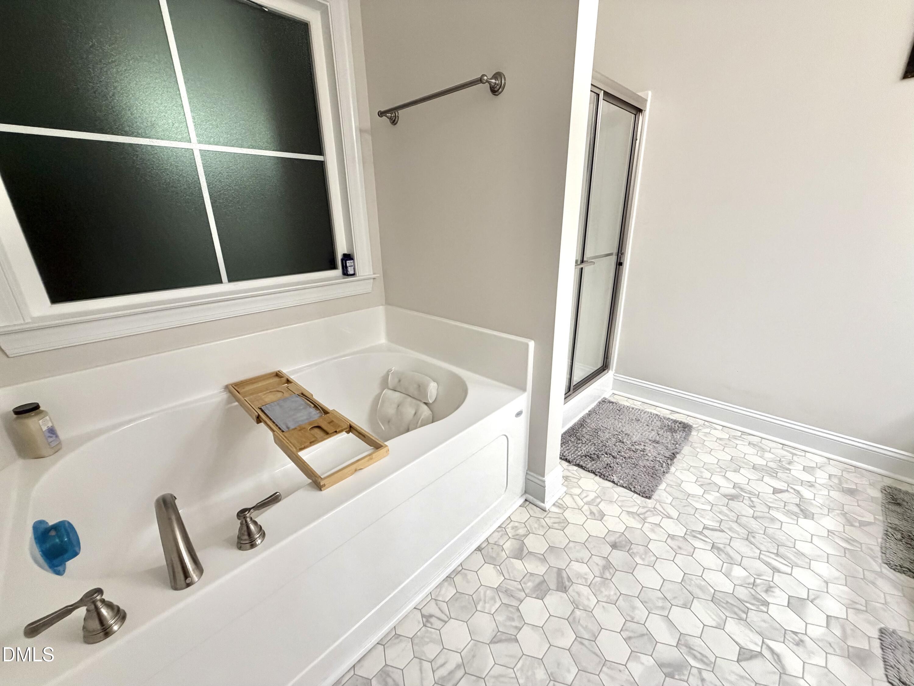 228 Ridgemoore Court Four Oaks, NC 27524 - Photo 11 of 30 a bathroom with a tub sink and shower