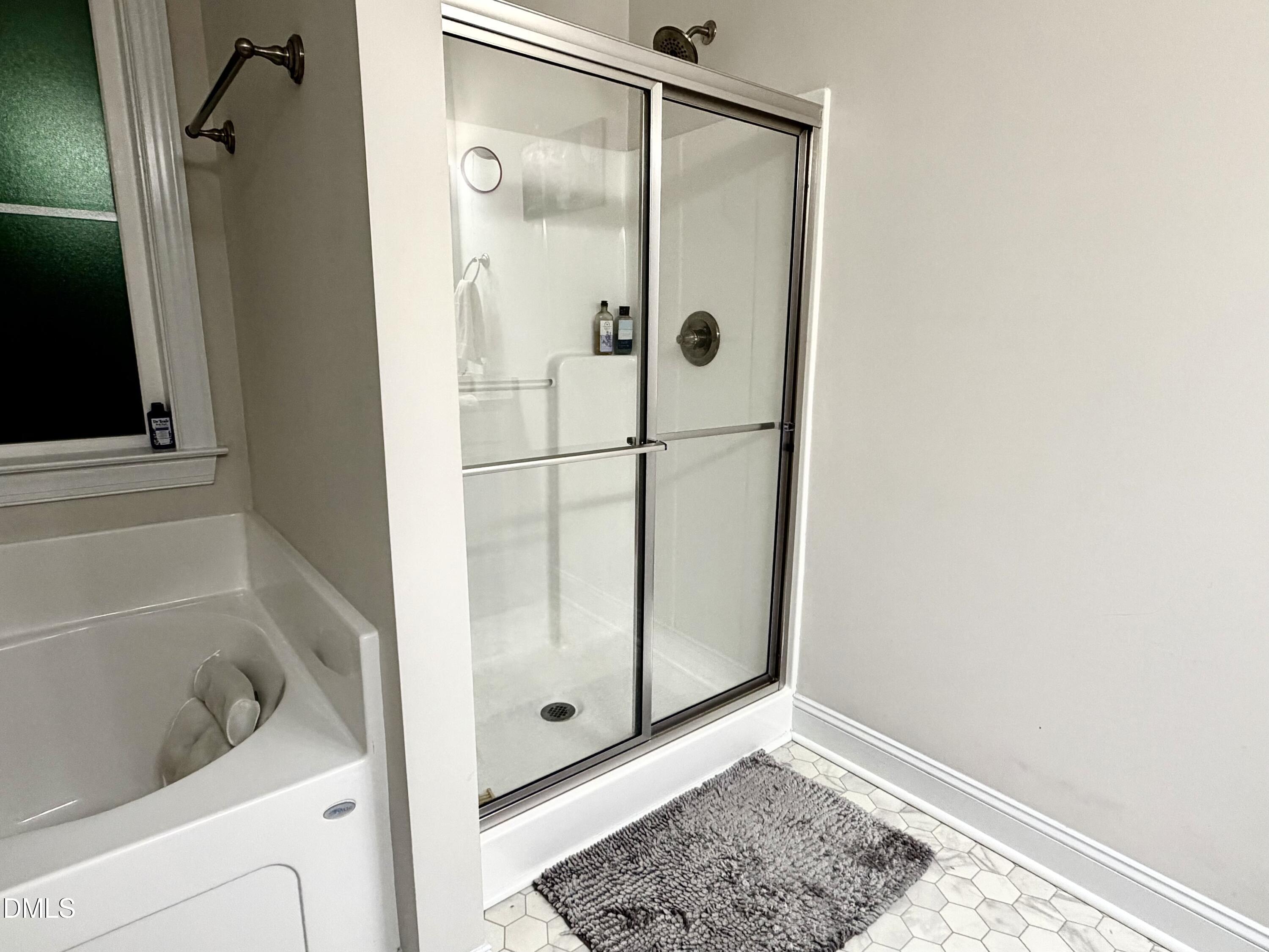228 Ridgemoore Court Four Oaks, NC 27524 - Photo 12 of 30 a bathroom with a shower and a toilet