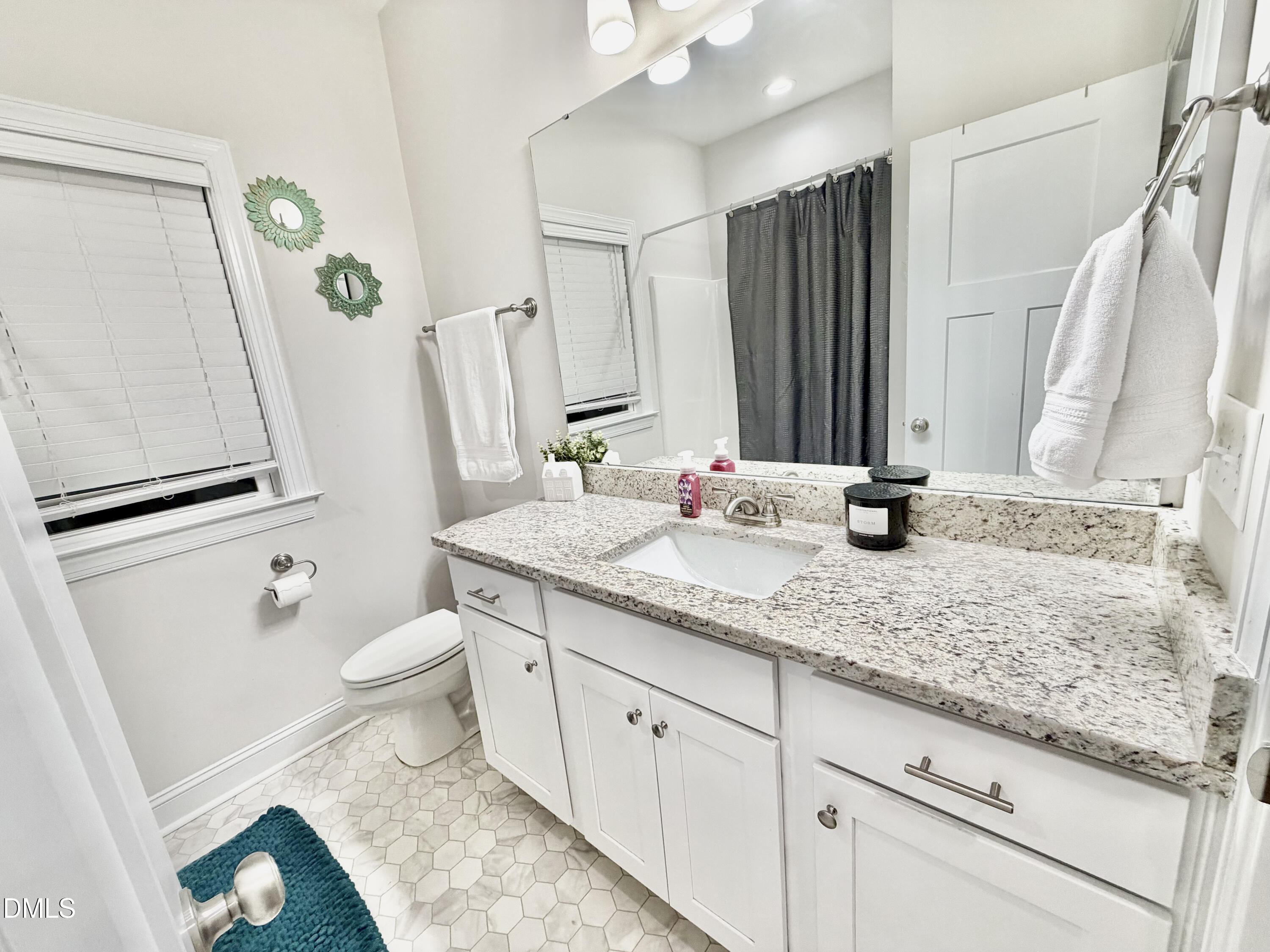 228 Ridgemoore Court Four Oaks, NC 27524 - Photo 15 of 30 a bathroom with a granite countertop sink toilet and shower