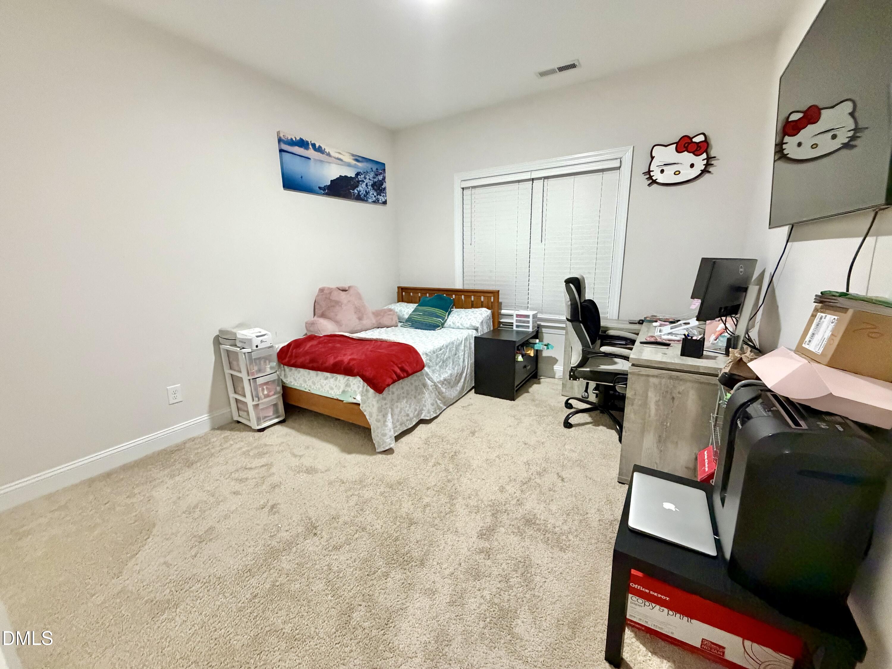 228 Ridgemoore Court Four Oaks, NC 27524 - Photo 20 of 30 a bedroom with bed and a window