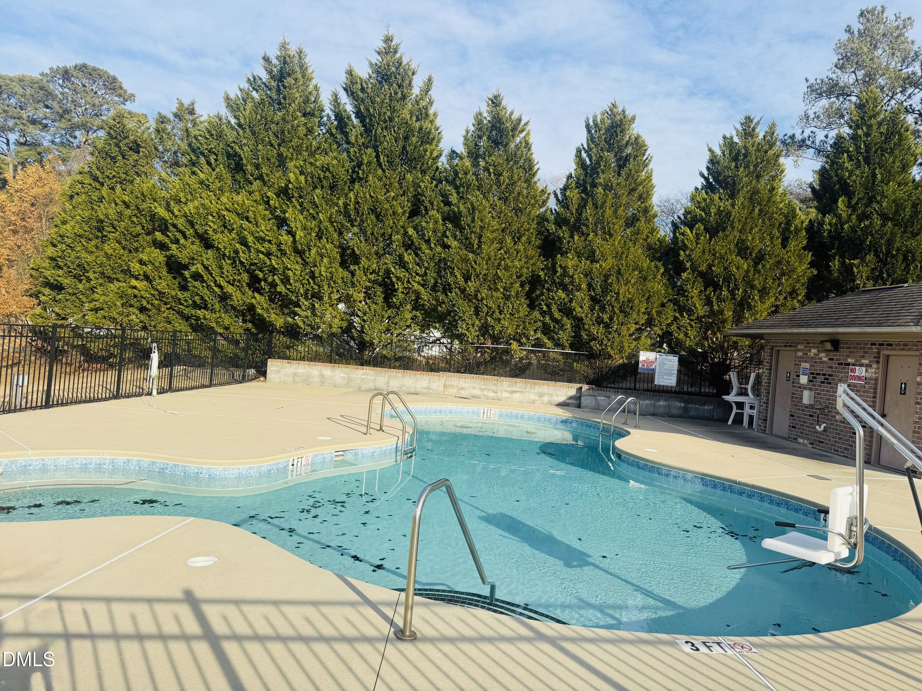 228 Ridgemoore Court Four Oaks, NC 27524 - Photo 29 of 30 a view of a swimming pool with an outdoor seating and plants