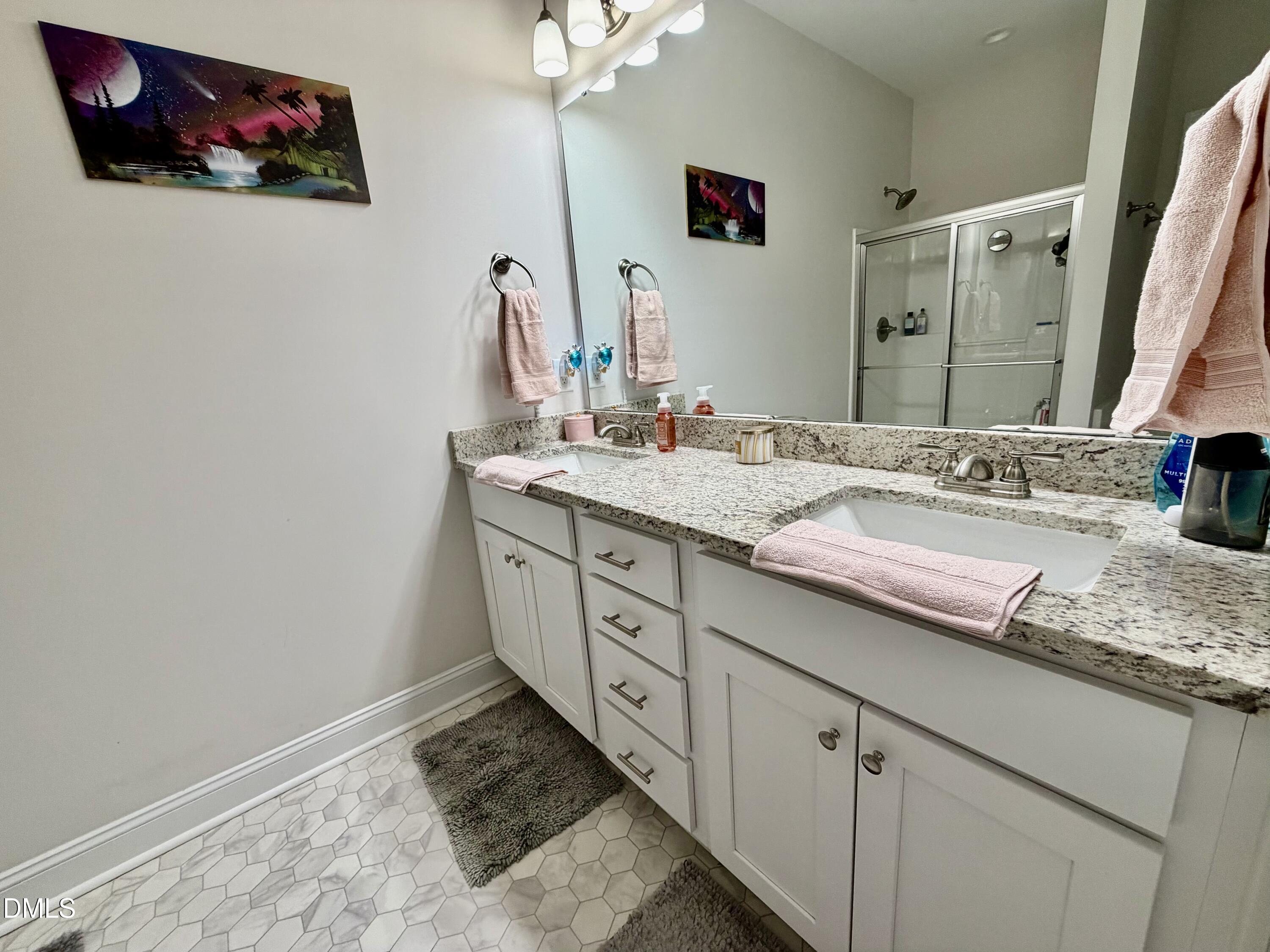 228 Ridgemoore Court Four Oaks, NC 27524 - Photo 10 of 30 a bathroom with a sink and a mirror