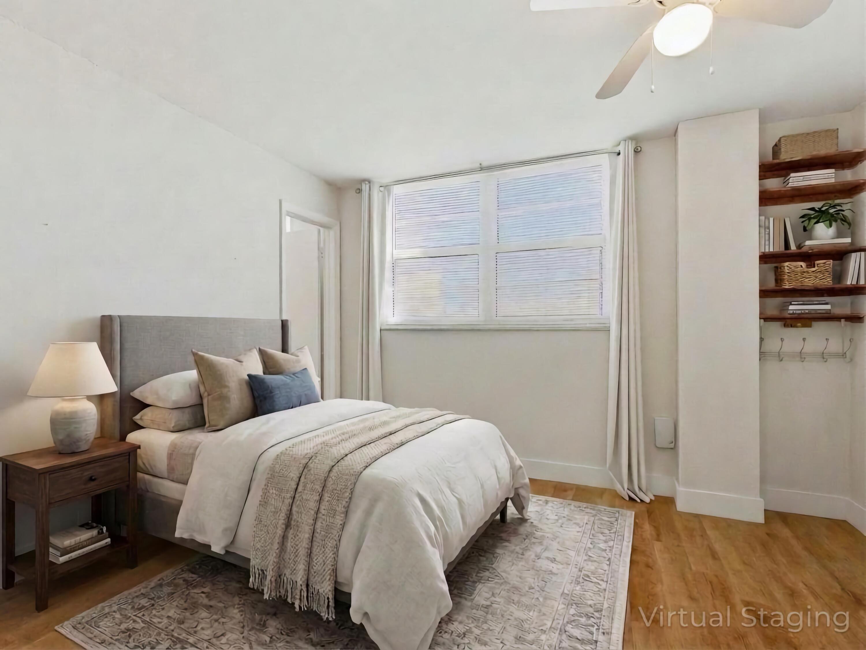 5500 Northwest 2nd Avenue, Unit 519 Boca Raton, FL 33487 - Photo 23 of 48 a bedroom with a bed and a window