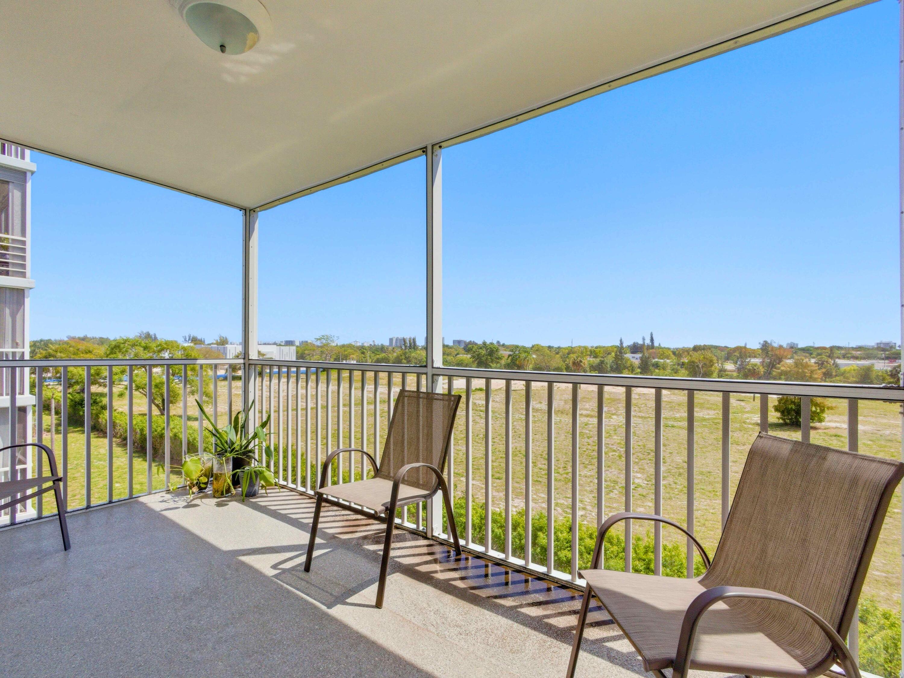 5500 Northwest 2nd Avenue, Unit 519 Boca Raton, FL 33487 - Photo 29 of 48 a view of a balcony with lake view and couches